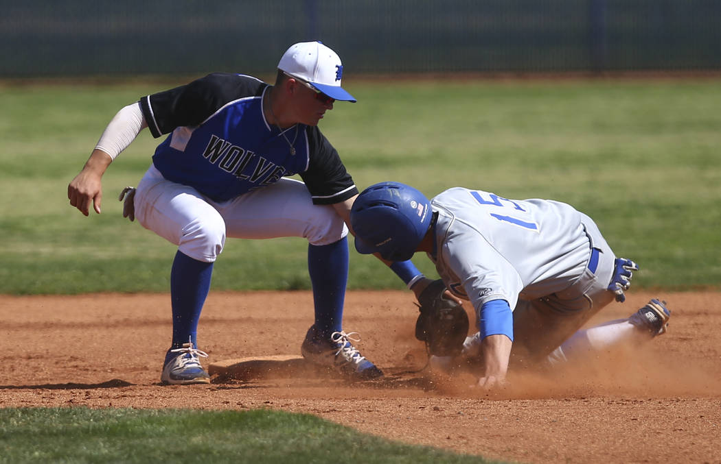 Basic’s Paul Myro (21) tags out Santa Margarita’s Josh Nicoloff (15), who was at ...