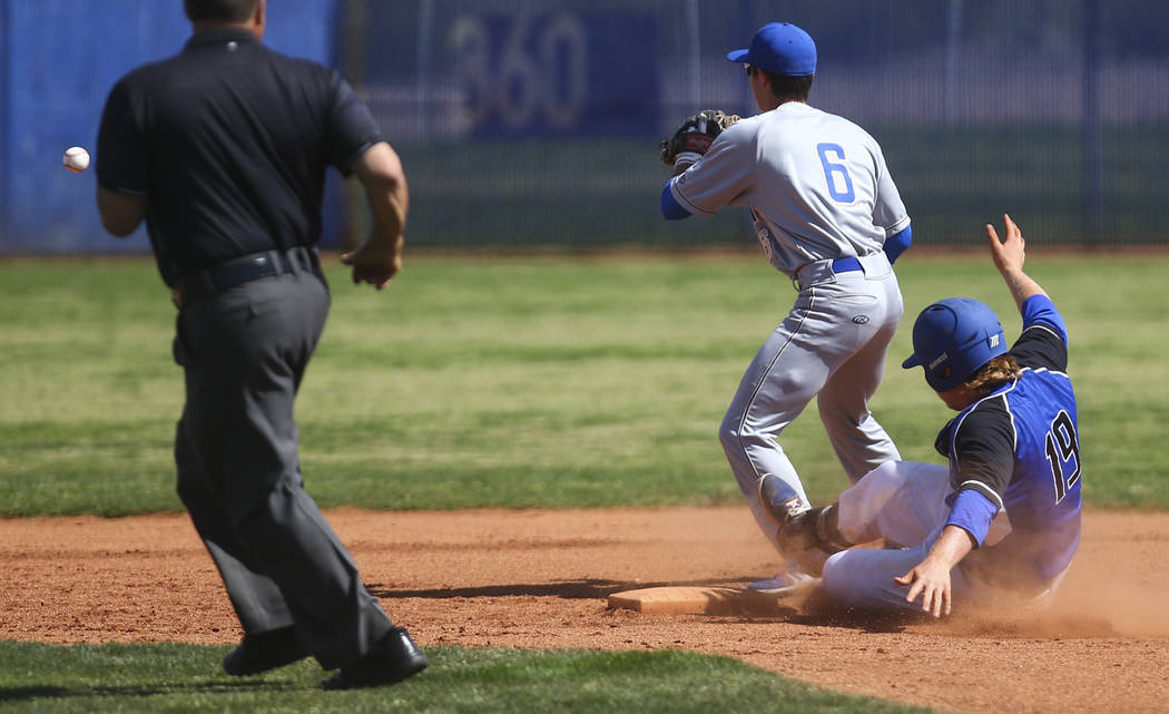 Basic’s Jack Wold (19) slides safely into second base against Santa Margarita’s ...