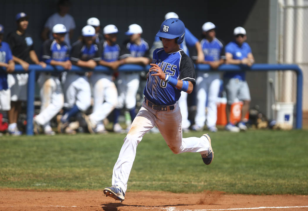 Basic’s John Howard Bobo (6) scores a run against Santa Margarita during a baseball ga ...