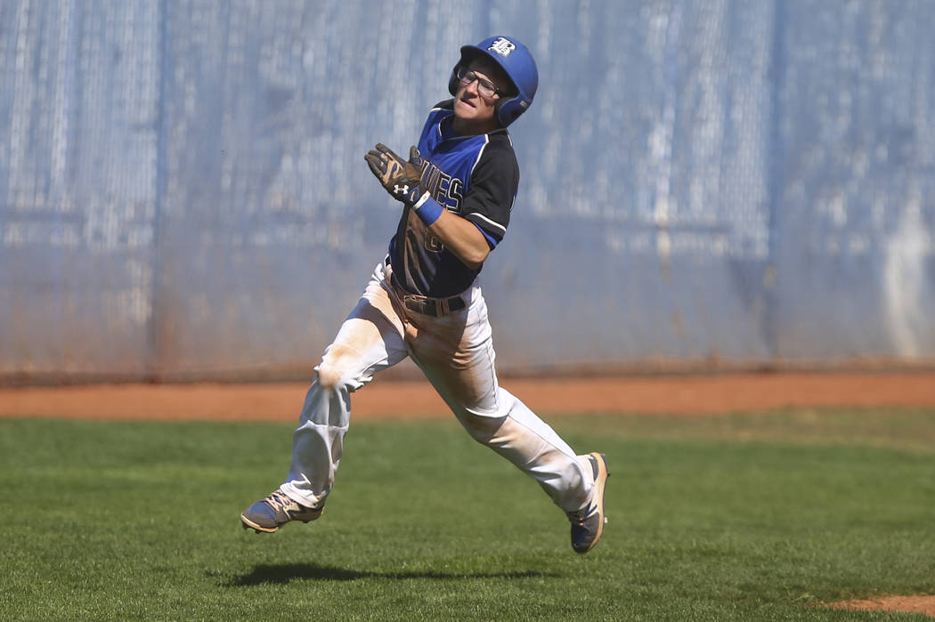 Basic’s John Howard Bobo (6) heads for home base to score a run against Santa Margarit ...