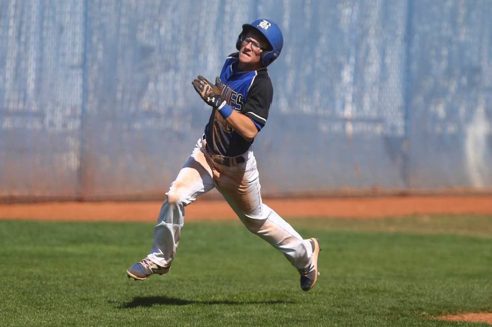 Basic’s John Howard Bobo (6) heads for home base to score a run against Santa Margarit ...