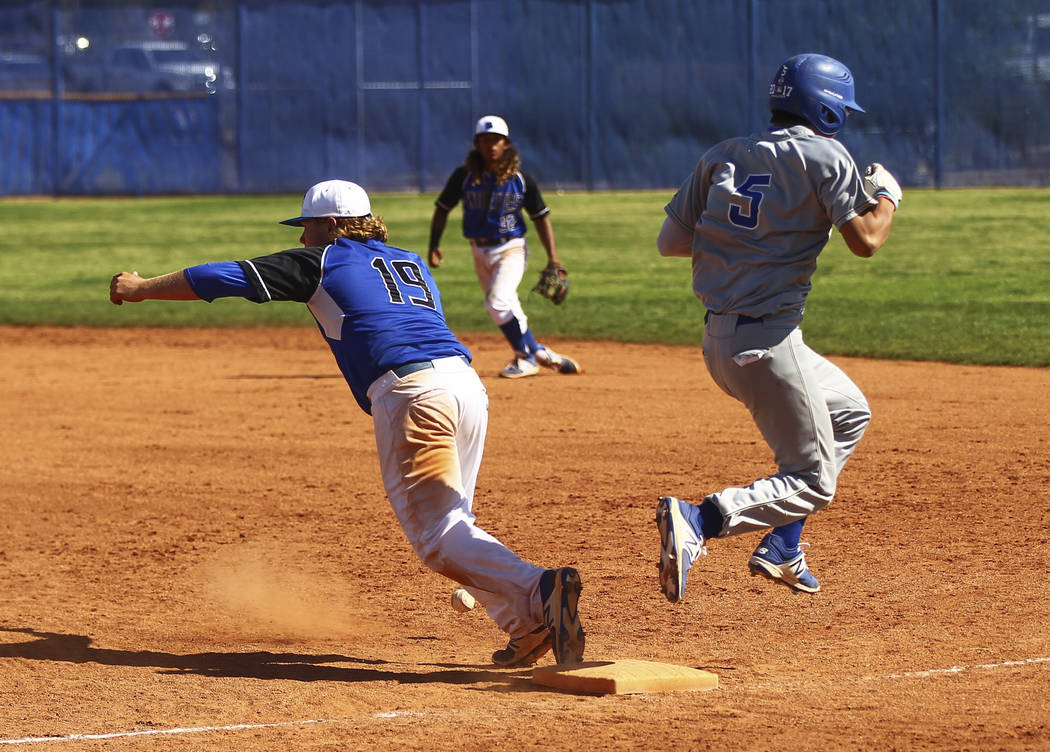 Santa Margarita’s Derek Park (5) makes it safely to first base against Basic’s J ...