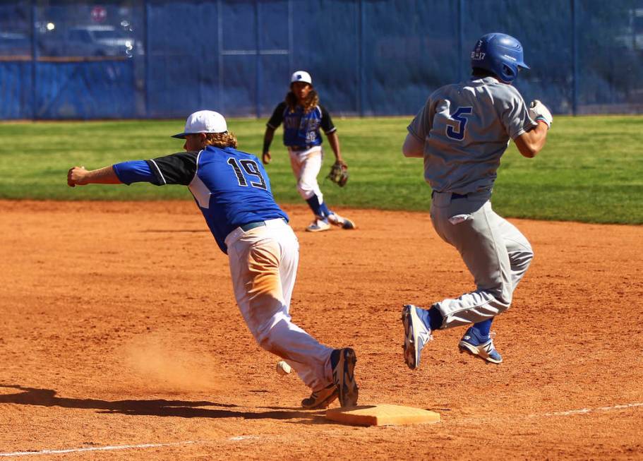 Santa Margarita’s Derek Park (5) makes it safely to first base against Basic’s J ...