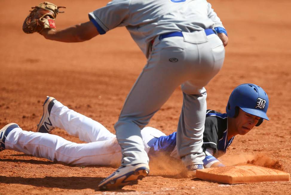 Basic’s John Howard Bobo (6) slides back into first base to stay safe against Santa M ...