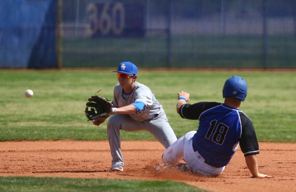 Basic’s Trace Evans (18) steals second base against Santa Margarita’s Austin Vil ...