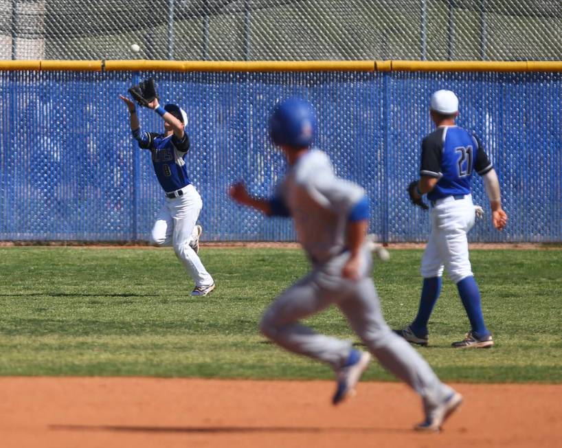 Basic’s Kyle Turner (8) catches a fly ball from Santa Margarita during a baseball game ...