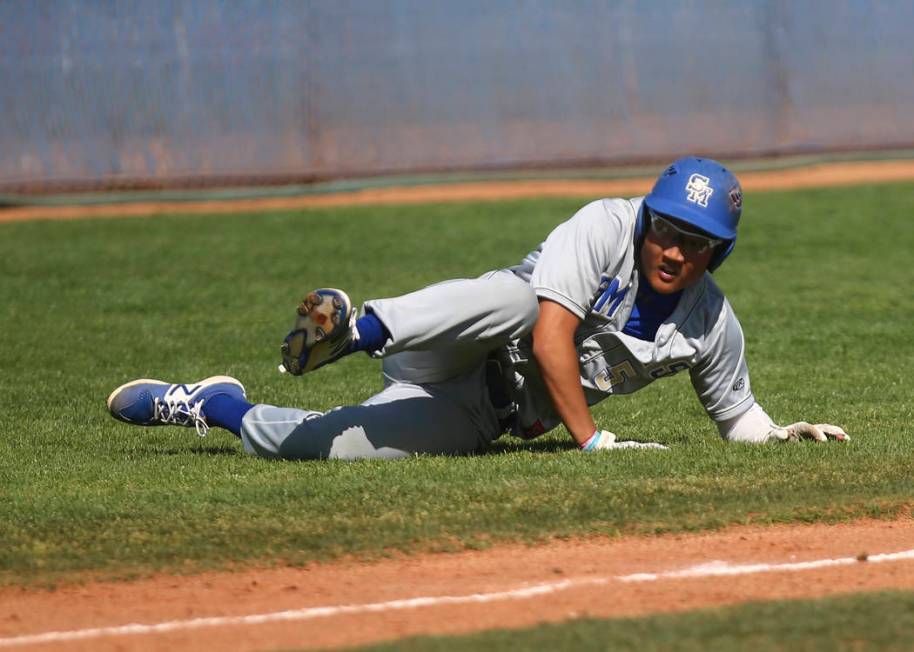 Santa Margarita’s Derek Park (5) trips up before getting tagged out by Basic during a ...