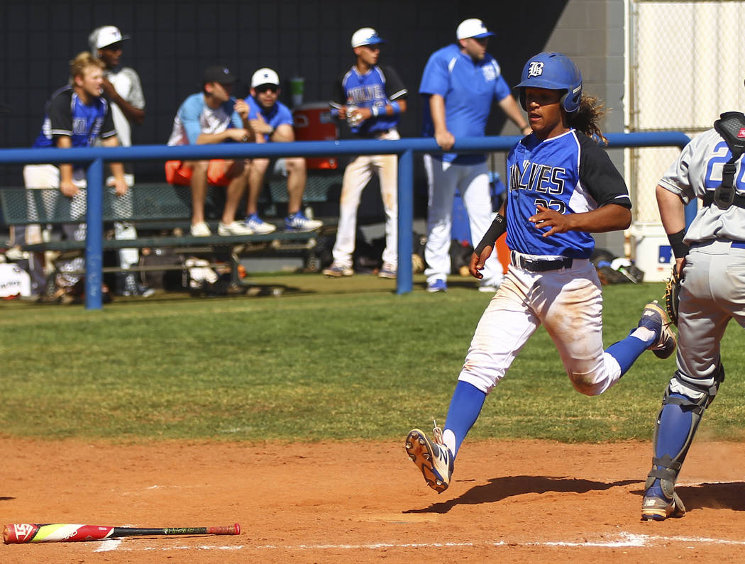 Basic’s Christian Rivero (32) scores a run against Santa Margarita during a baseball g ...