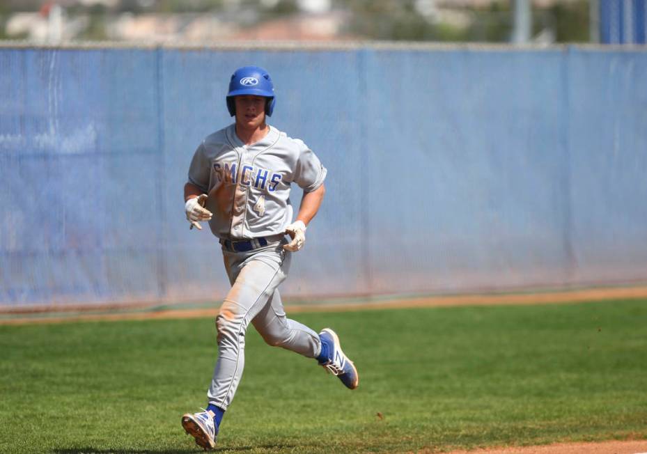 Santa Margarita’s Conner Longrie (4) heads for home base to score a run against Basic ...