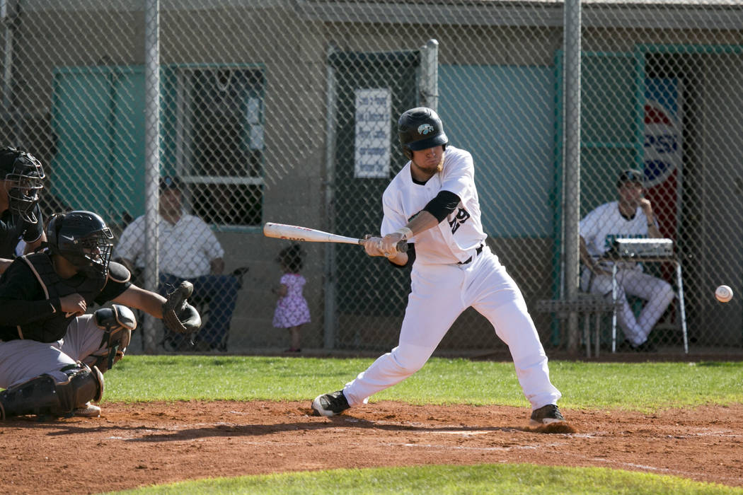 Silverado senior Payton Ballard (29) swings at the ball during a game against Rancho at Silv ...