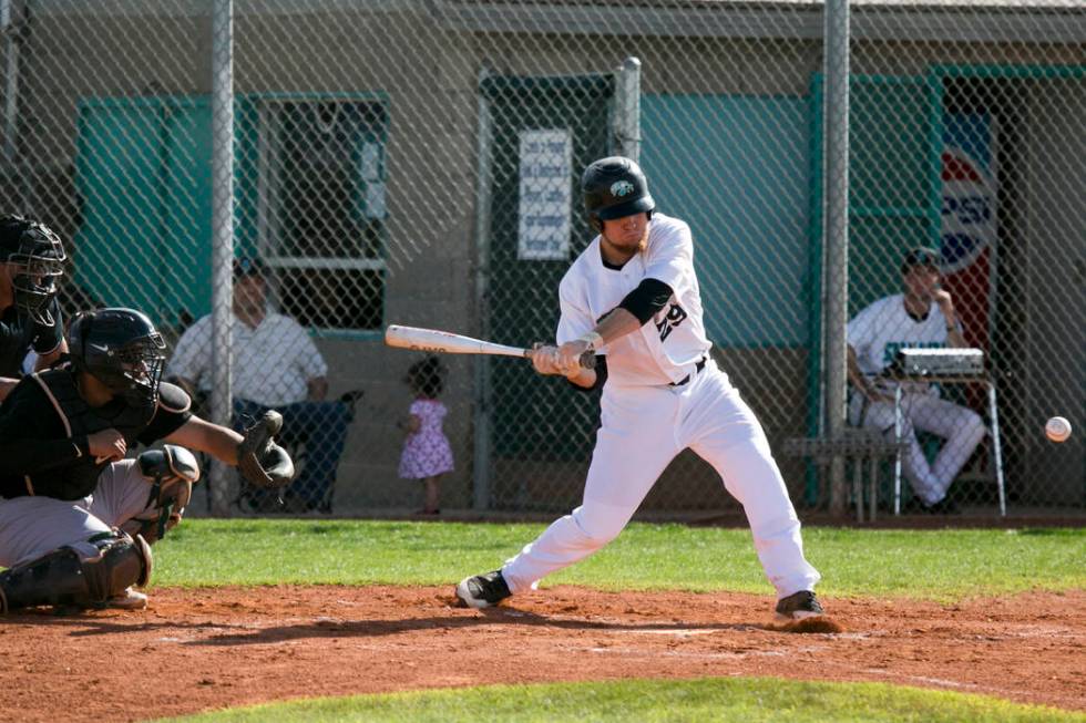 Silverado senior Payton Ballard (29) swings at the ball during a game against Rancho at Silv ...