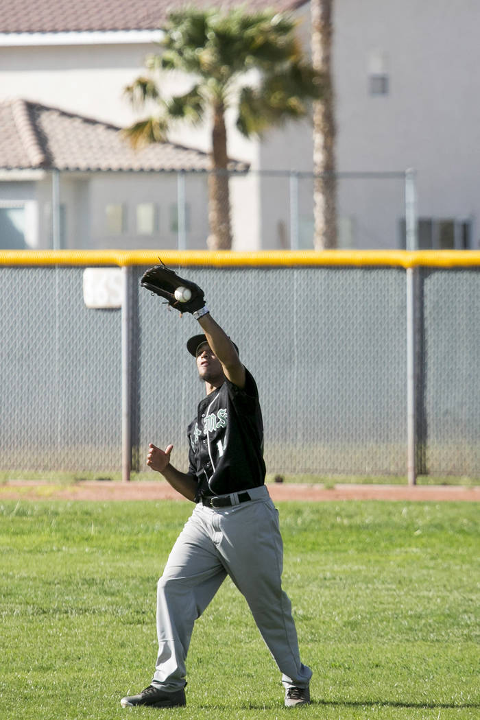 Rancho junior Joseph Walls (14) catches the ball in the outfield during a game against Silve ...