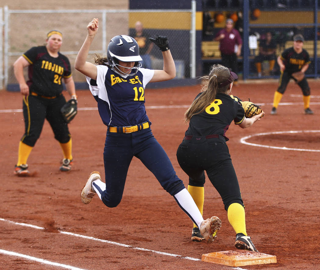 Boulder City’s Summer Coyle (12) is tagged out at first base by Pahrump’s Jill S ...