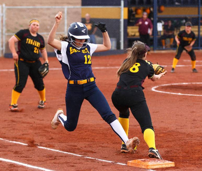 Boulder City’s Summer Coyle (12) is tagged out at first base by Pahrump’s Jill S ...