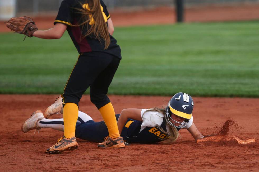 Boulder City’s Ashley Wishard (8) makes it safely back to second base during a softbal ...