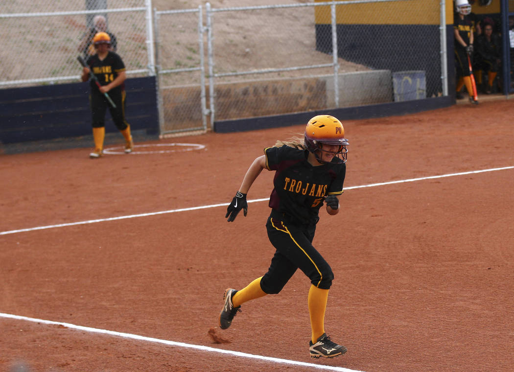 Pahrump’s Skyler Lauver (5) runs for first base during a softball game at Boulder City ...