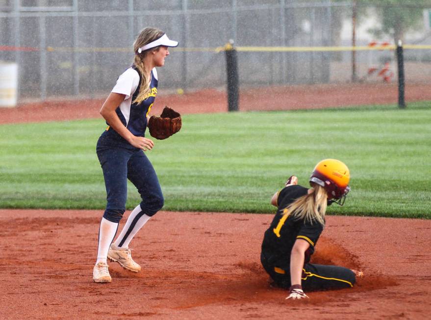 Pahrump’s Terrena Martin (1) slides into second base against Boulder City’s Ashl ...