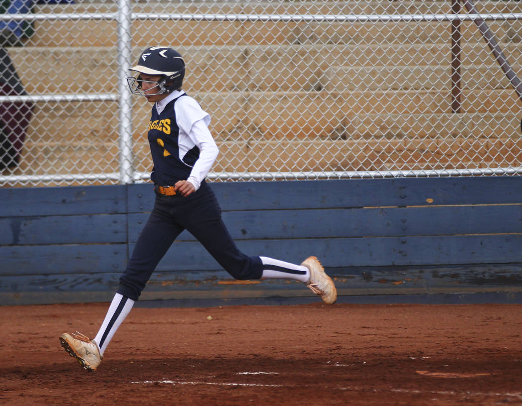 Boulder City’s Ryann Reese (2) scores a run against Pahrump during a softball game at ...