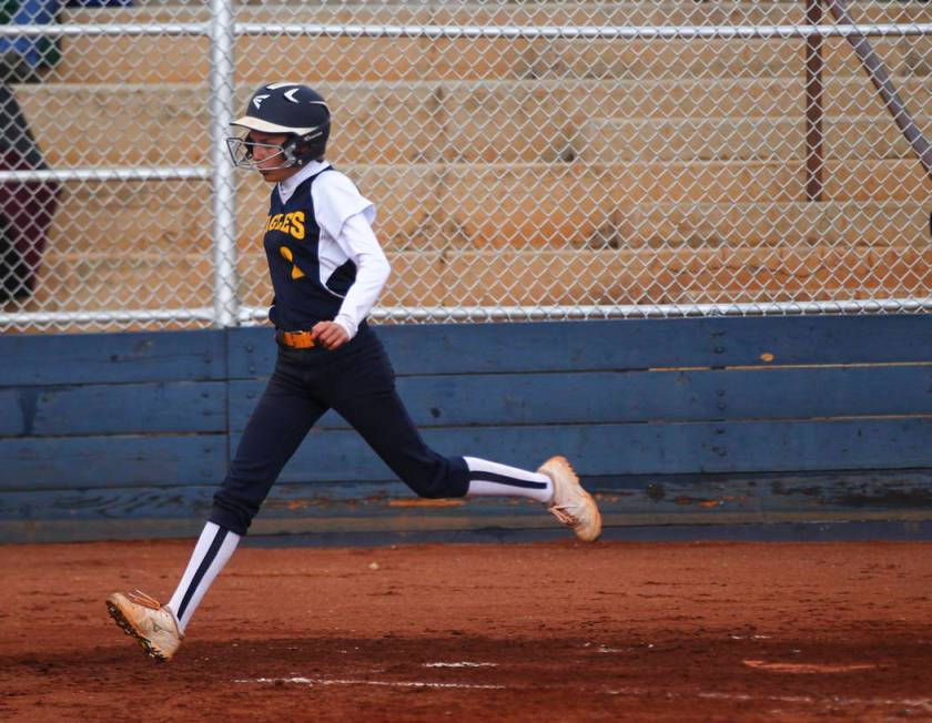 Boulder City’s Ryann Reese (2) scores a run against Pahrump during a softball game at ...