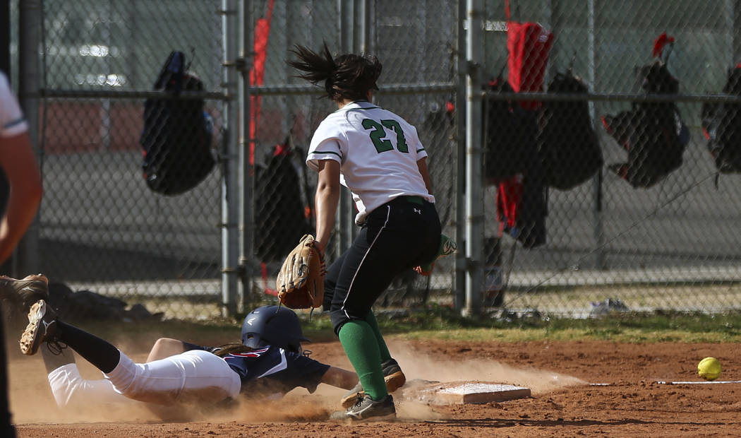 Coronado’s Tatum Spangler (5) slides back into third base to stay safe as Rancho&#8217 ...