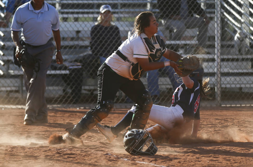 Rancho’s Yvette Sanchez (15) tags out Coronado’s Marissa Kopp (8) at home base d ...