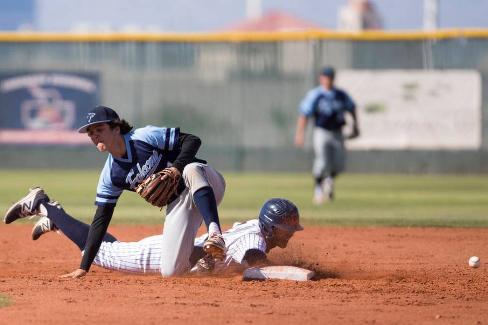 Coronado’s Jake McLean (17) slides safely to second base against Foothill’s Bray ...