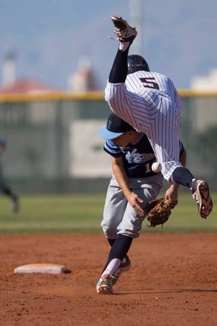 Coronado’s John Cascardo (5) leaps over Foothill’s Chase Parenteau before gettin ...