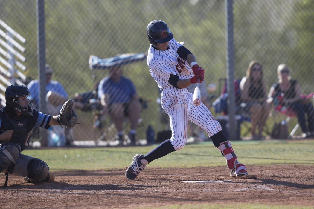 Coronado’s Jake McLean (17) swings for a three-run homer against Foothill in their bas ...