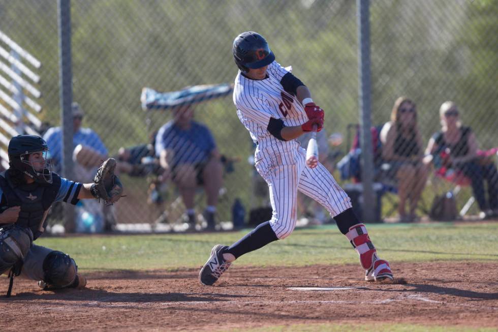 Coronado’s Jake McLean (17) swings for a three-run homer against Foothill in their bas ...