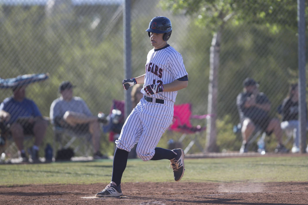 Coronado’s Landon Rowland (12) runs home for a score against Foothill in their basebal ...