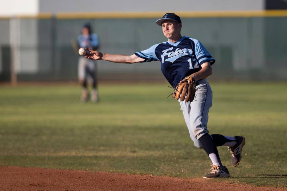 Foothill’s Chase Parenteau (12) throws to first base for an out against Coronado in t ...