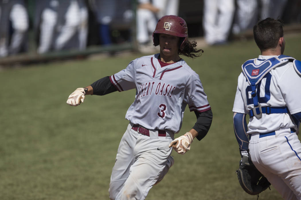 Desert Oasis Kyle Fuentes (3) runs home for a run against Bishop Gorman at Bishop Gorman Hig ...