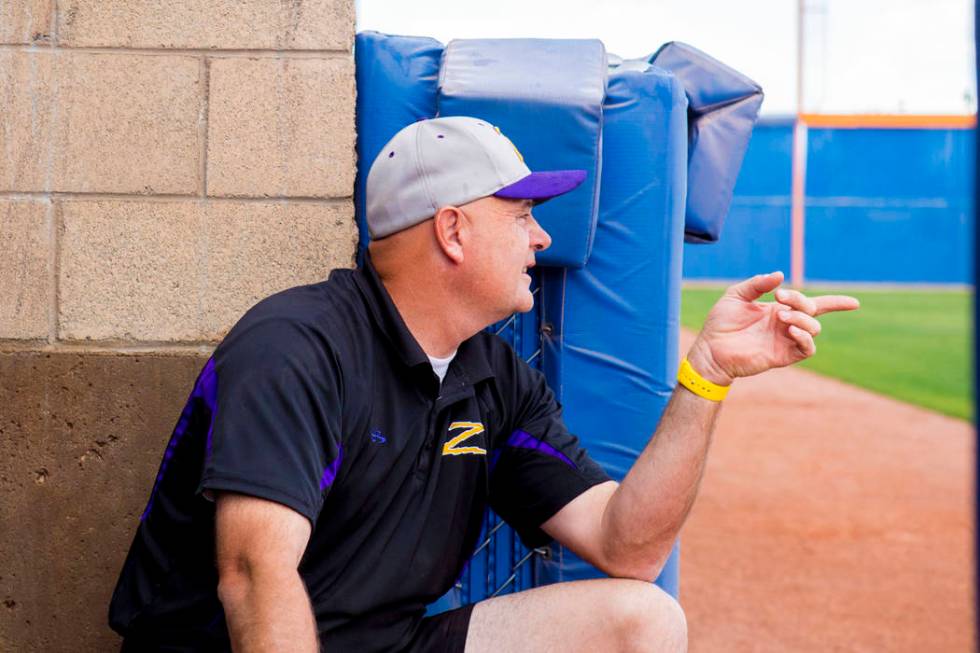 Durango High School softball head coach Roy Goodell speaks with his team during a game again ...