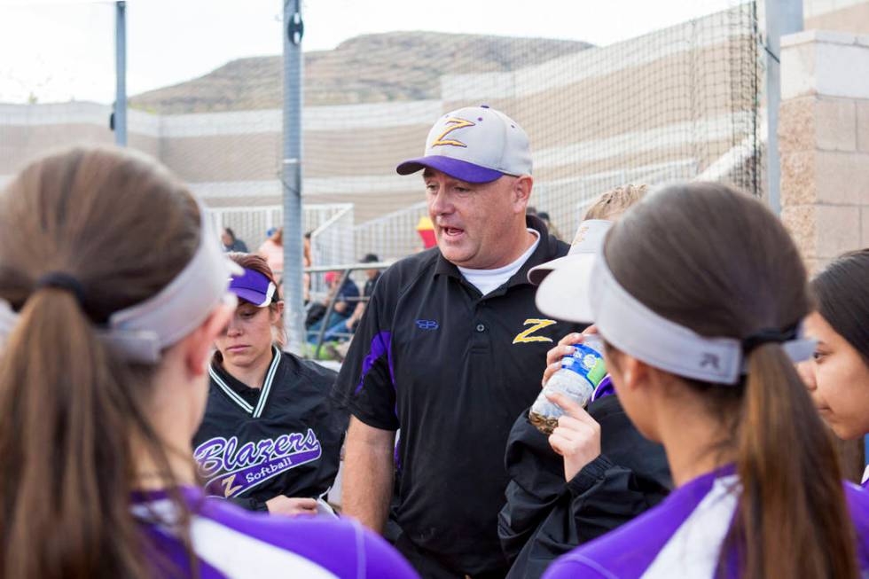 Durango High School softball head coach Roy Goodell speaks with his team during a game again ...