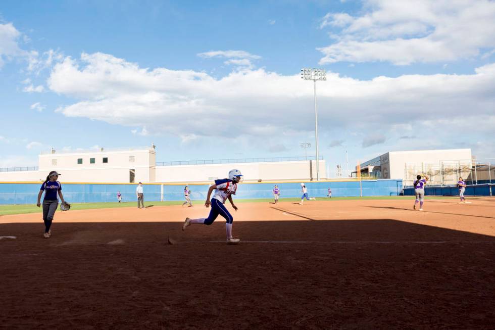 Bishop Gorman’s Reyna Martin (33) runs toward home during a game against Durango at Bi ...