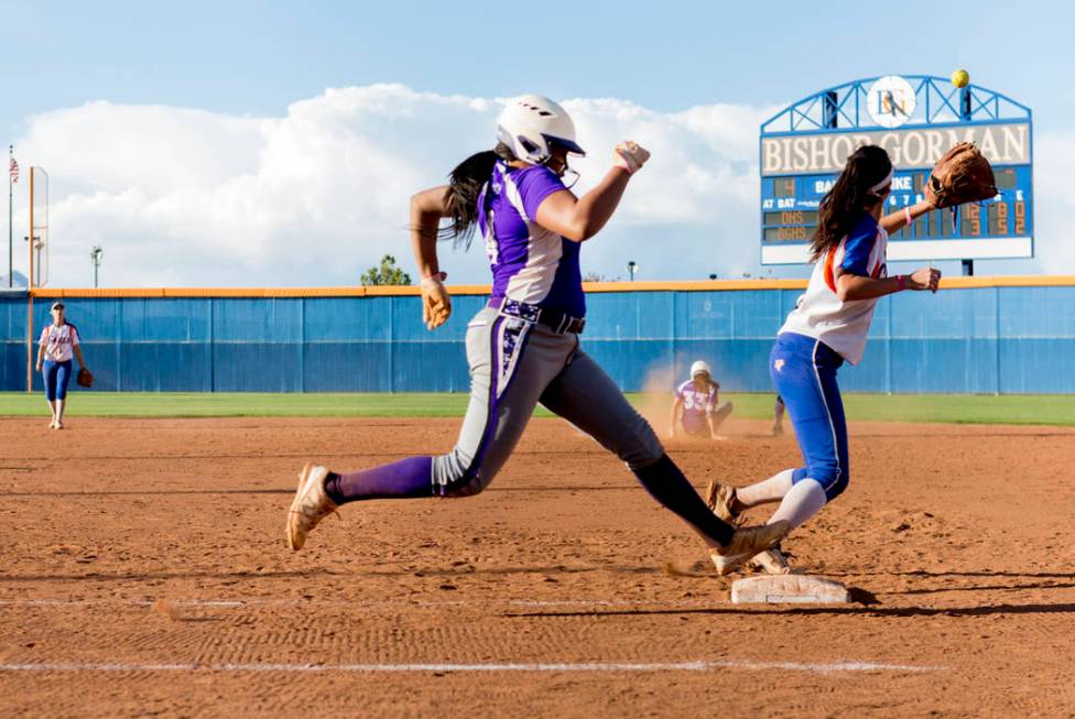 Durango’s Trinity Valentine (4) successfully reaches first base against Bishop Gorman ...