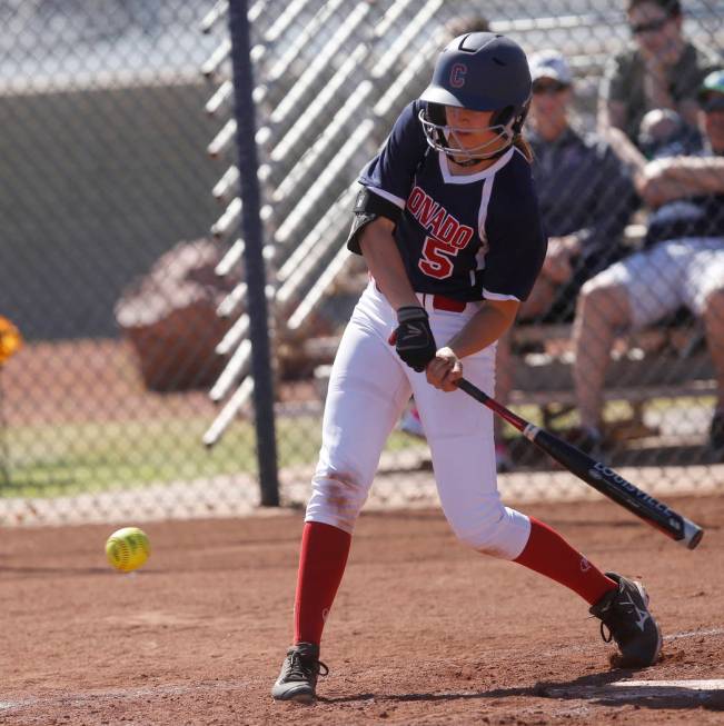 Coronado’s Tatum Spangler (5) swings during the second inning of a high school softbal ...