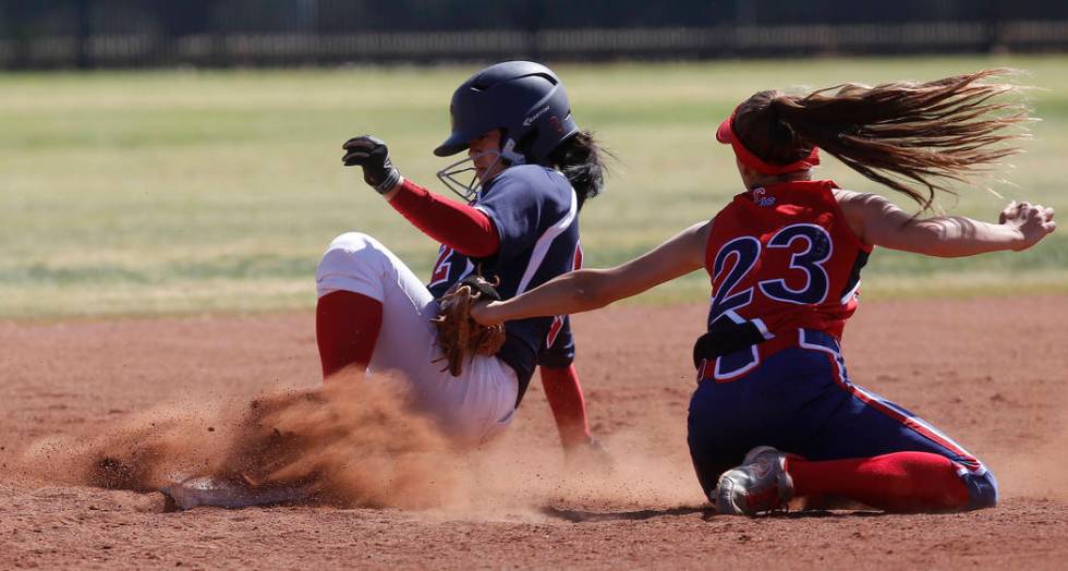 Coronado’s Alexis Okamura (2) is safe at second base as Liberty’s McKenna Hefley ...