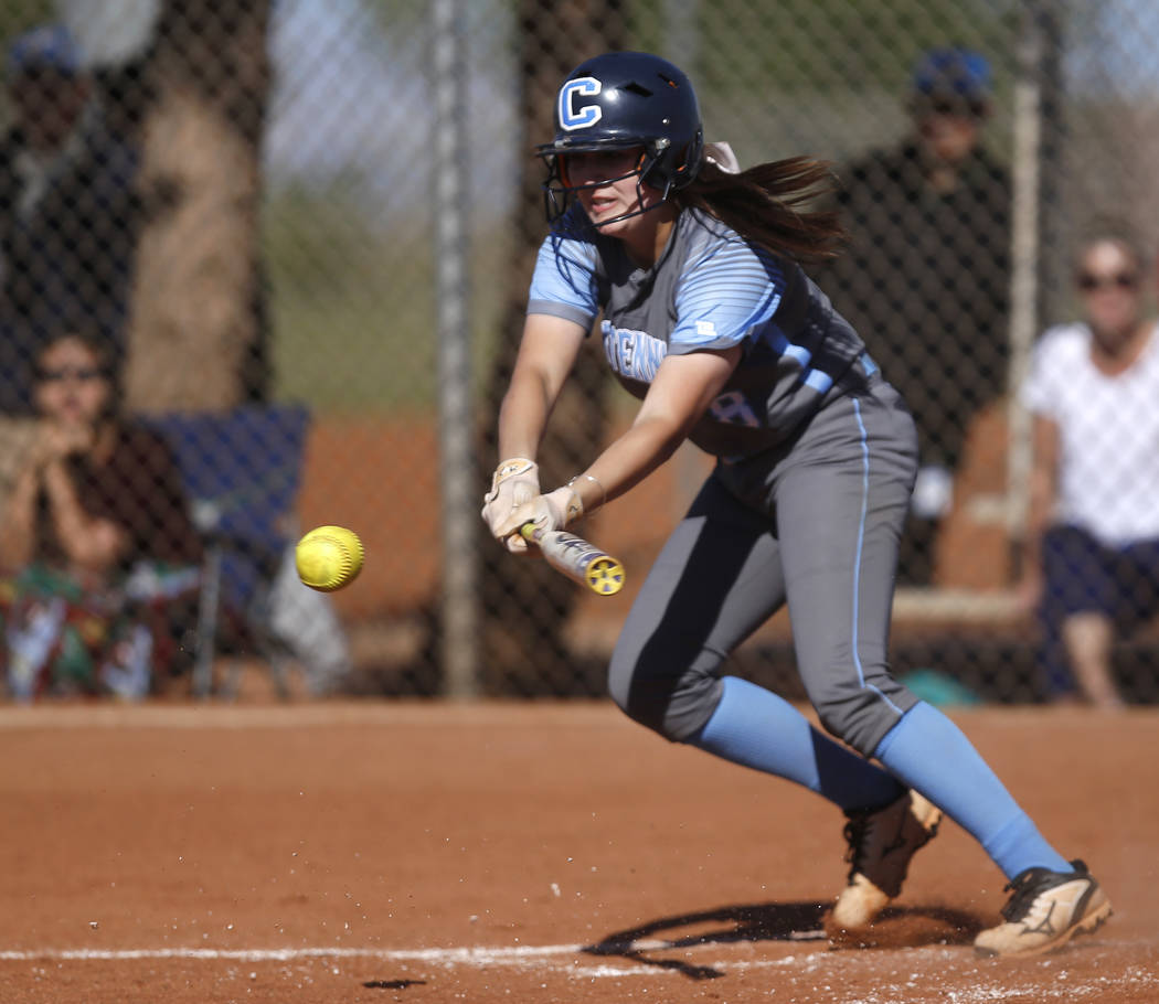 Centennial’s Haylee Lupinetti (8) bunts during the second inning of a high school soft ...