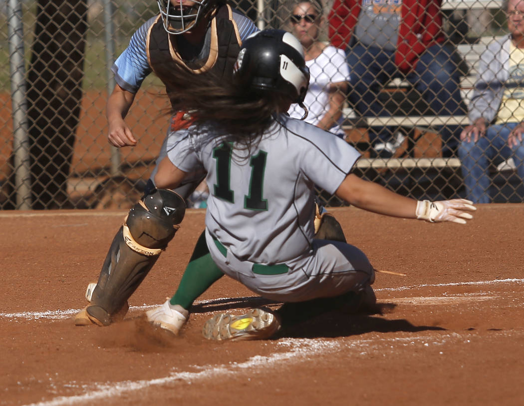 Palo Verde’s Keyana Neveu (11) scores a run during the third inning of a high school s ...