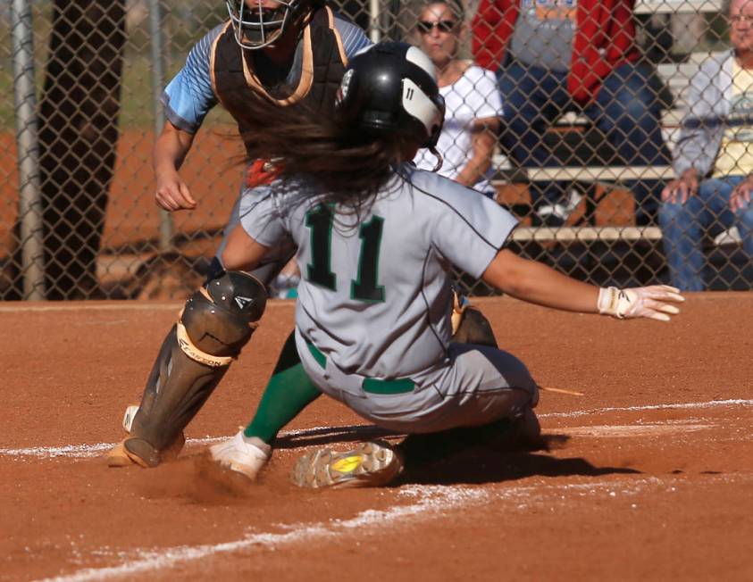 Palo Verde’s Keyana Neveu (11) scores a run during the third inning of a high school s ...