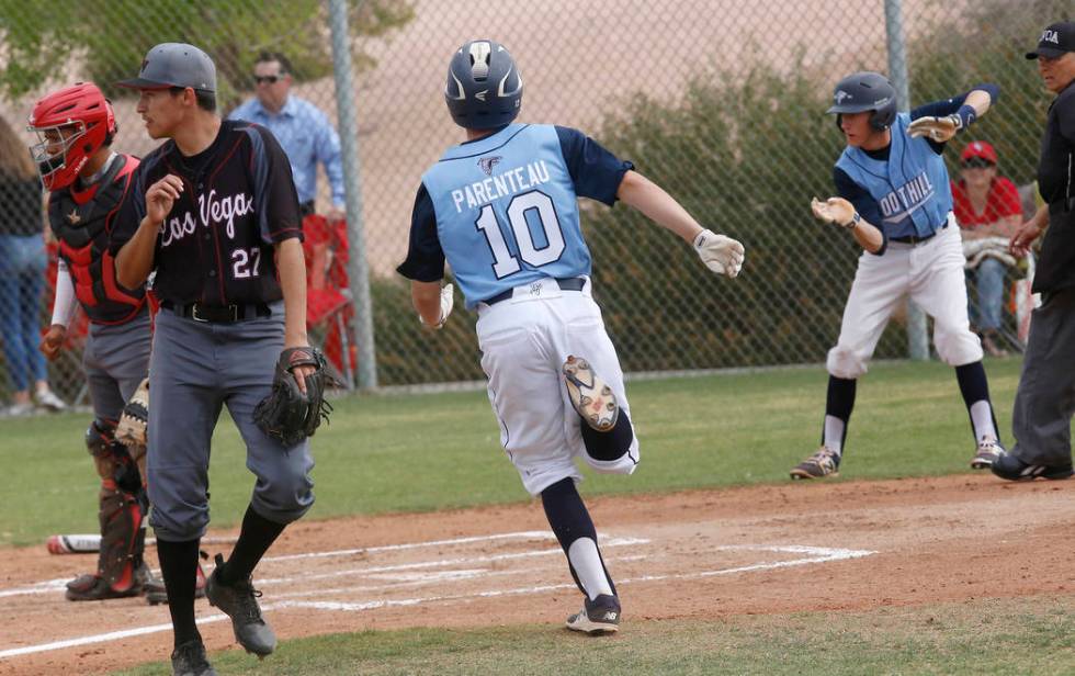 Foothill’s Chayse Parenteau (10) scores a run during the first inning of a high school ...