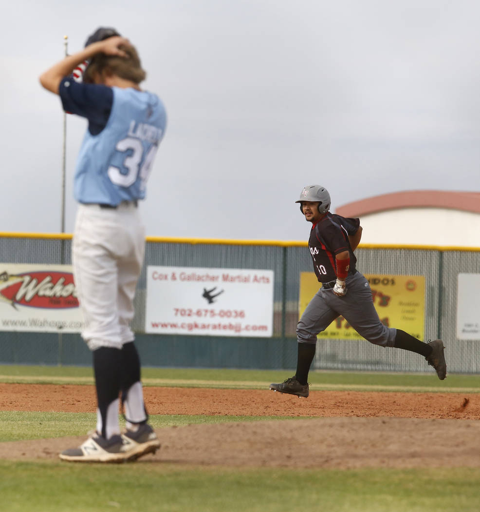 Foothill’s Kelton Lachelt (34) reacts after Las Vegas’s Leonel Anaya (10) hits a ...