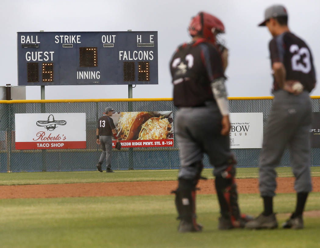 Las Vegas’s pitcher and catcher huddles at the mound during the seventh inning of a hi ...