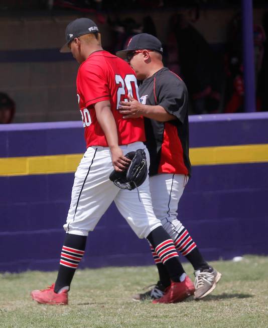 Banning’s Gabriel Ruiz (20) walks off the field as he is relieved from pitching during ...