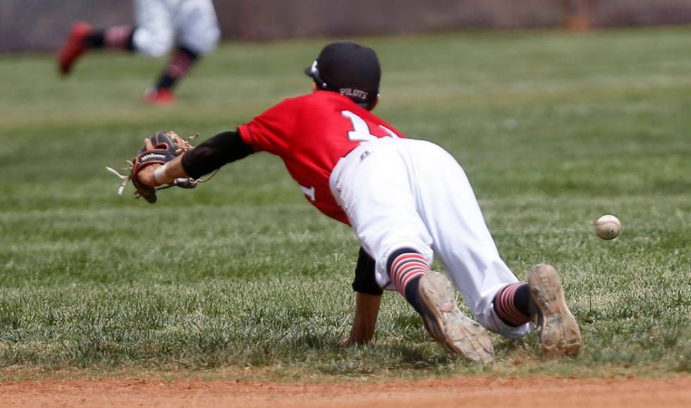 Banning’s Omar Muro (11) misses a catch during the fifth inning of a high school baseb ...