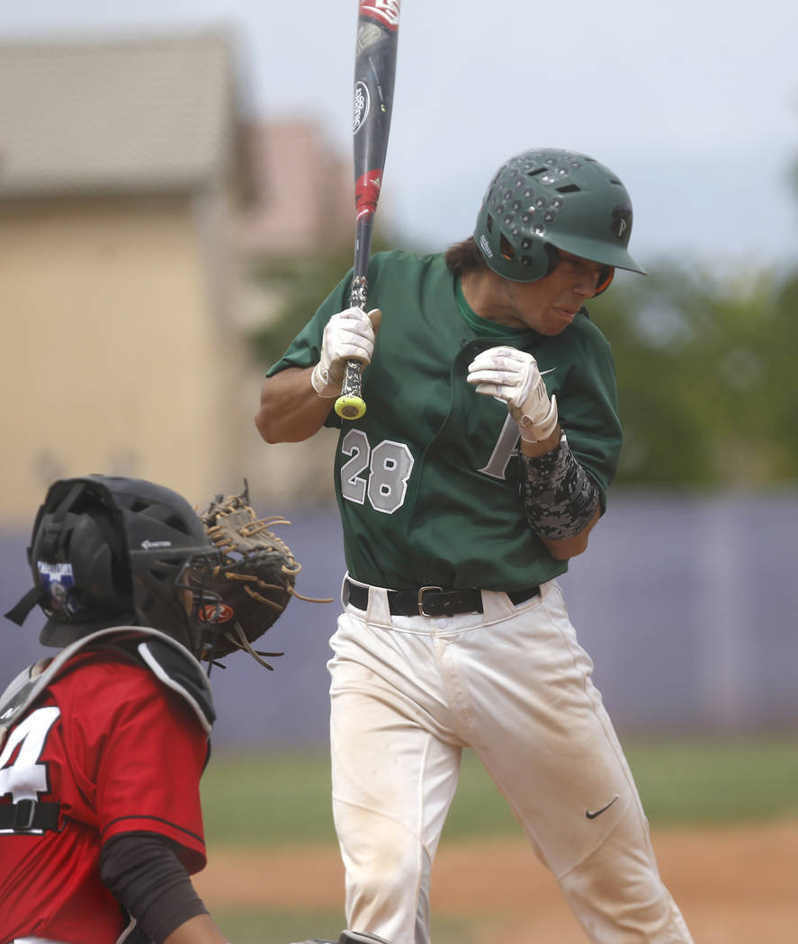 Palo Verde’s Chandler Kochan (28) reacts after being hit by a pitch during the seventh ...