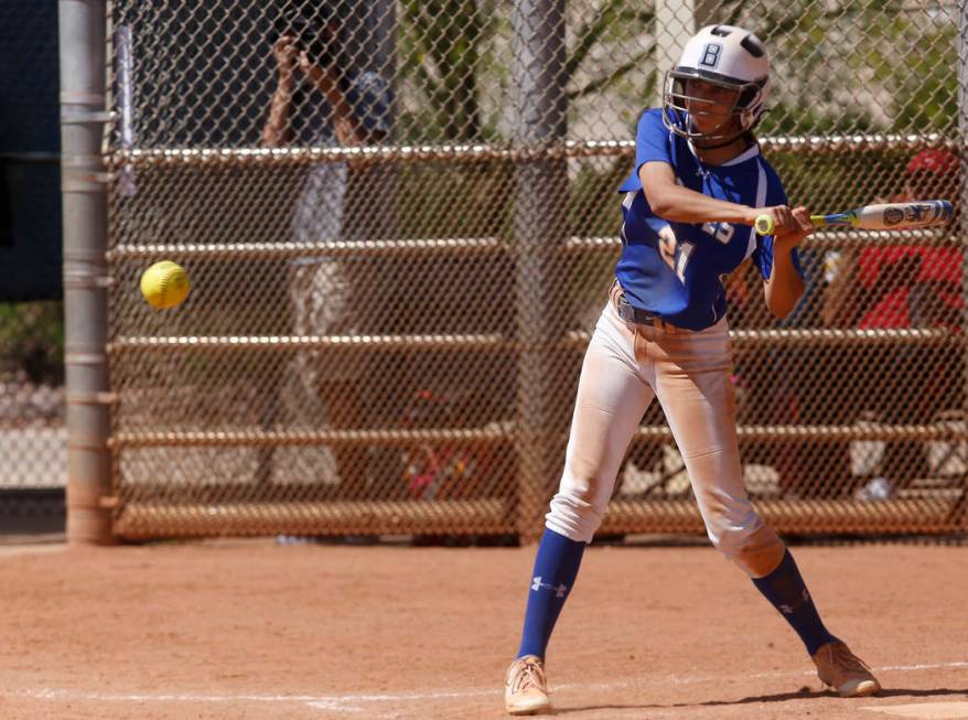 Basic’s Alyssa Ferguson (21) swings during a high school softball game at Majestic Par ...