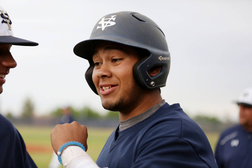 Spring Valley’s Humberto Maldonado (33) fist pumps his teammates during a game against ...