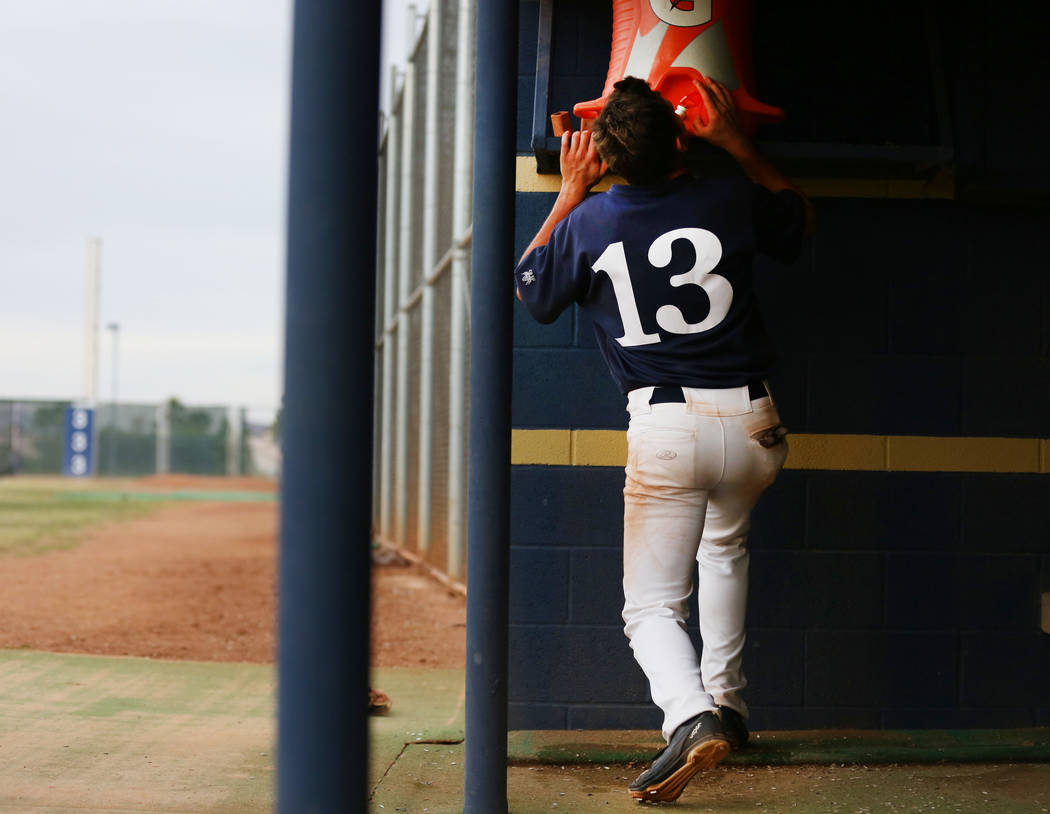 Spring Valley’s Kade Higgins gets a drink after scoring in the fifth inning against Si ...